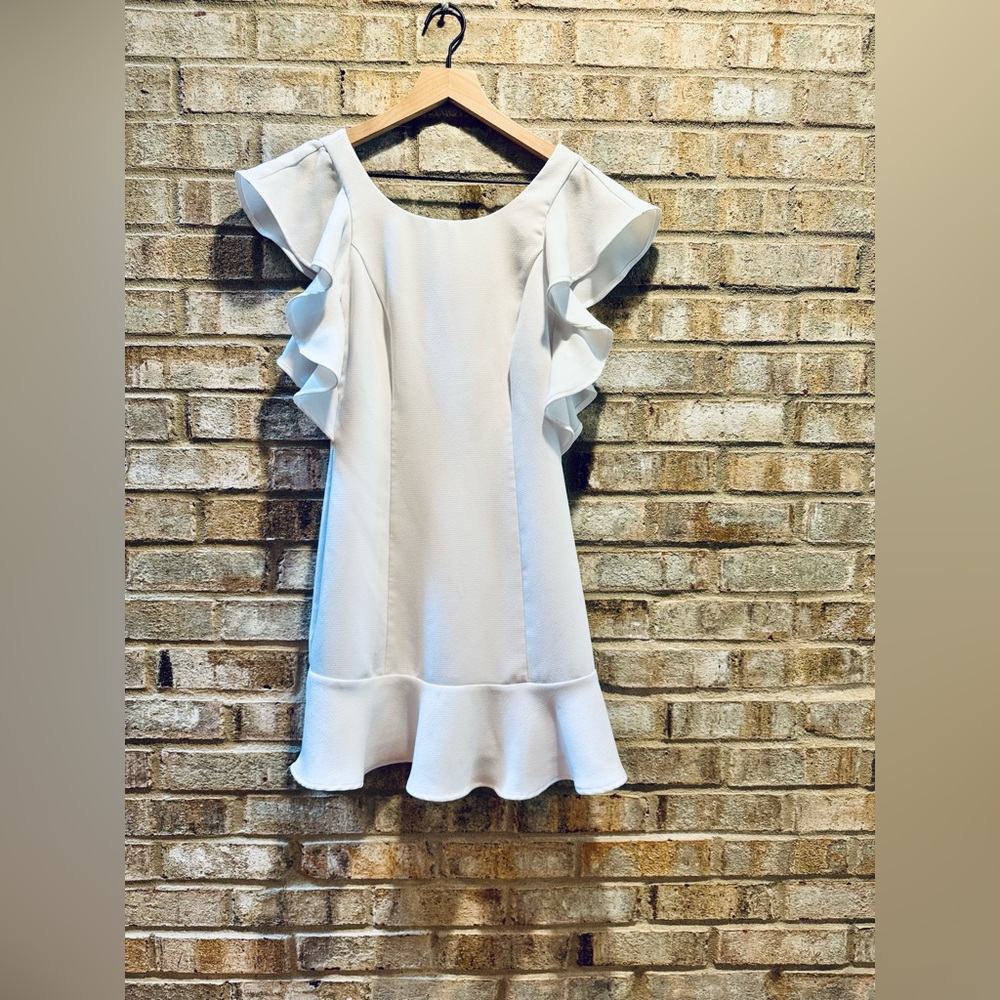 Dress with flutter sleeves and soft ruffle hem 🤍
